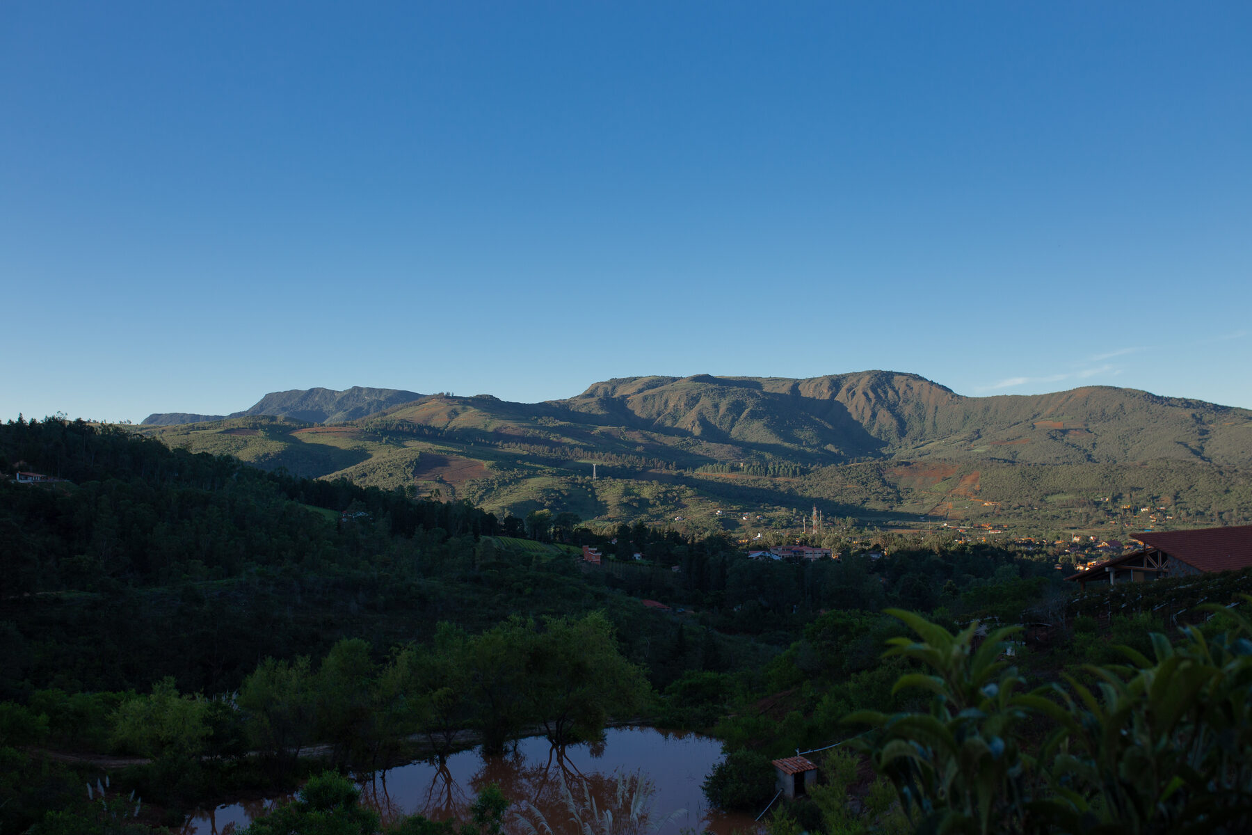 The green valley and water below the town